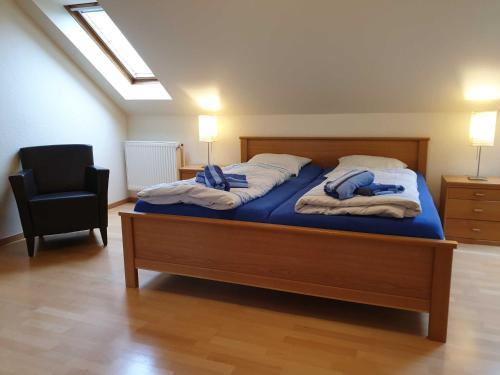 En eller flere senge i et værelse på Ferienhaus Jantje Moe 4