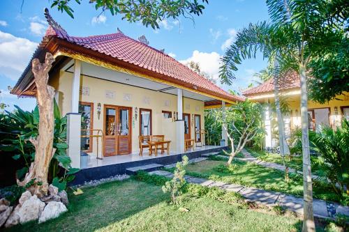 Jardín al aire libre en Taos House Lembongan By DeWizZ Management