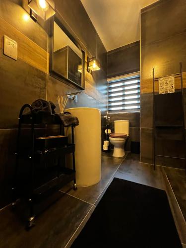 a bathroom with a sink and a toilet in it at Trendy Seaside Escape 2 Bedroom Penthouse in Marsaskala
