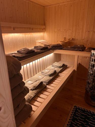 a sauna with a bench in the middle of it at Sauna House Smyczyna in Smyczyna