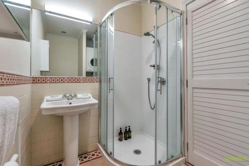 a bathroom with a shower and a sink at AWSA On the Water Luxury (4021) in Auckland