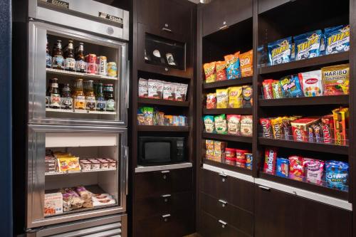 a refrigerator filled with lots of food and drinks at Courtyard by Marriott San Diego Carlsbad in Carlsbad