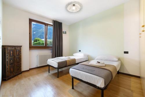 Postel nebo postele na pokoji v ubytování Katzemburg 5 Plus Arco