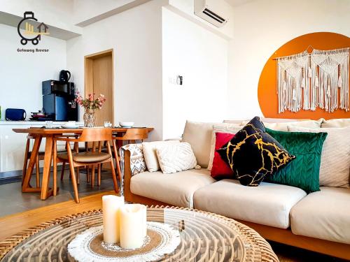 a living room with a couch and a table at 1 min to Seaview & Sunrise Heart of Kuantan in Kuantan