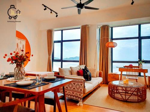 a living room with a couch and a table at 1 min to Seaview & Sunrise Heart of Kuantan in Kuantan