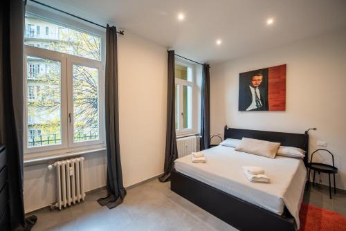 Postel nebo postele na pokoji v ubytování Top Living Apartments - Porta Susa