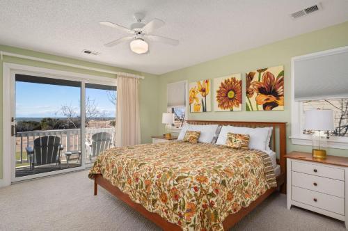 a bedroom with a bed and a window with a view at MS15 Sound View in Nags Head