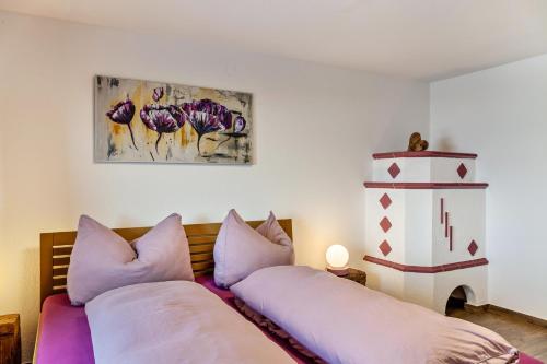 a bedroom with two beds with pillows at Apart Rofan 45m2 in Bruck am Ziller