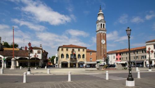 a town square with a clock tower in the distance at Casa Venezia e Riviera in Mirano