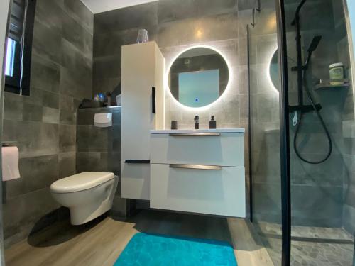 a bathroom with a toilet and a sink and a shower at Maison avec piscine in Agay - Saint Raphael