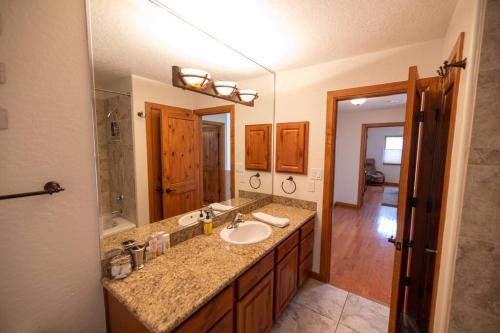 a bathroom with a sink and a large mirror at *20% New Listing Discount! Tramway Home By Sandias in Albuquerque