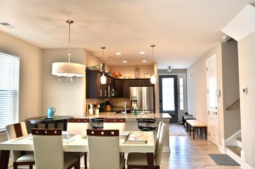 a kitchen and dining room with a table and chairs at Spacious House near the Beach 300 in Myrtle Beach