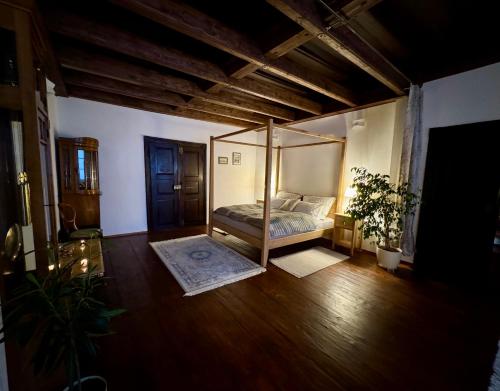 a bedroom with a canopy bed in a room at Maison Český Krumlov in Český Krumlov