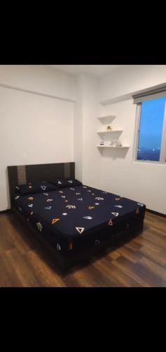 En eller flere senge i et værelse på MAIN PLACE USJ21 SUBANG JAYA