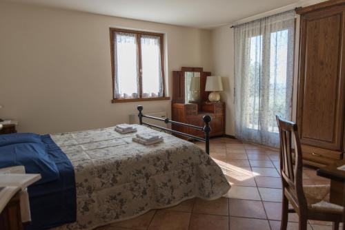 Postel nebo postele na pokoji v ubytování La Maestà Tuscan Sun