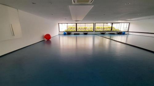 a bowling alley with a red ball on the floor at Punta del Este - Green Life - Top amenities in Punta del Este