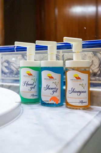 a group of four bottles of honey on a counter at #056 Old Post Office by Home Holidays in Albufeira