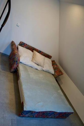 a couch with pillows on it in a room at Haus Allgäu Wohnung Schwabennestle in Türkheim