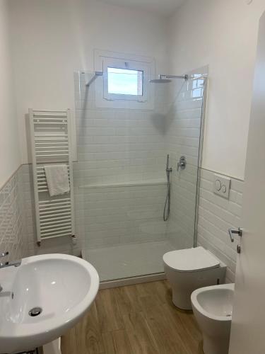 a bathroom with a shower and a toilet and a sink at A Ca' di Giulietto in Albenga