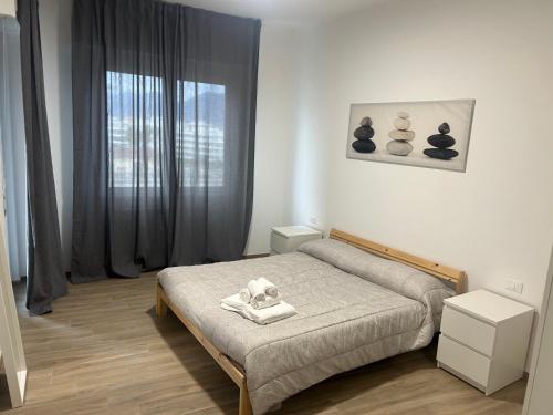 a bedroom with a bed with a towel on it at A Ca' di Giulietto in Albenga