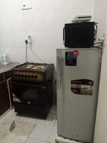 Η κουζίνα ή μικρή κουζίνα στο Wema stays air Bnb