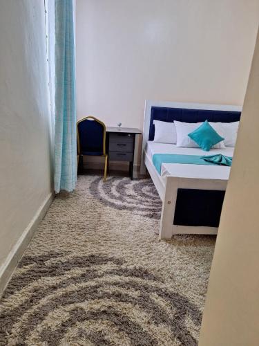 Ένα ή περισσότερα κρεβάτια σε δωμάτιο στο Wema stays air Bnb