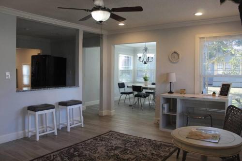 a living room with a kitchen and a dining room at ☆The Oasis in Murray Hill☆ -sleeps 8- WiFi- Cozy in Jacksonville