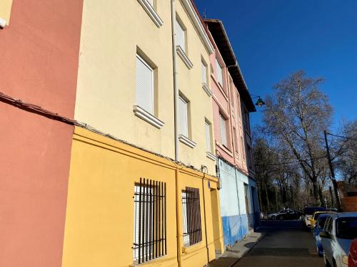 a yellow building on the side of a street at Housingleon- Camino de Santiago by Bike I y II in León