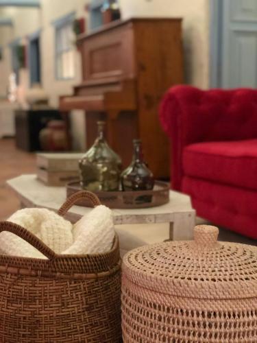 two baskets sitting on a table in a living room at Casa Provenzal in Villa de Leyva