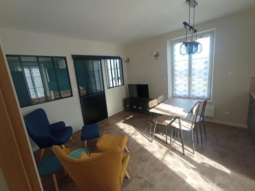 Posezení v ubytování Gîte aux Mille et un Détours