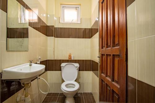 a bathroom with a toilet and a sink at Mtwapa HomeStay 3br Apartments in Mombasa