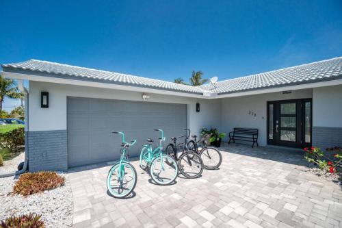 three bikes parked in front of a house at Villa Tranquility-Waterfront-Punta Gorda, FL in Punta Gorda
