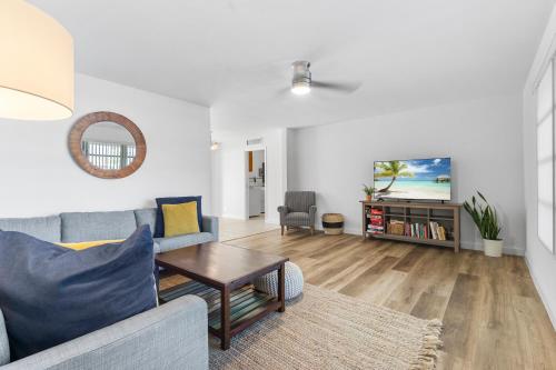 a living room with a couch and a table at Family Retreat near Beach, Downtown and PGA in Palm Beach Gardens