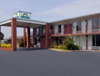 a hotel building with a sign on top of it at Days Inn by Wyndham Jonesboro AR in Jonesboro