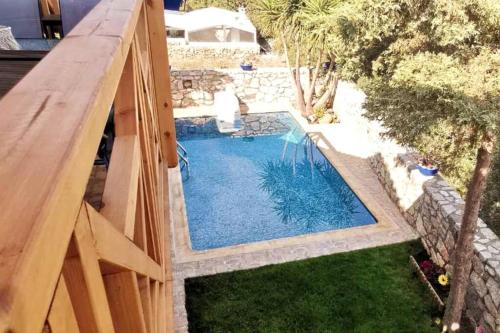 an overhead view of a swimming pool in a backyard at Beautiful Villa with a private pool ! in Heraklion