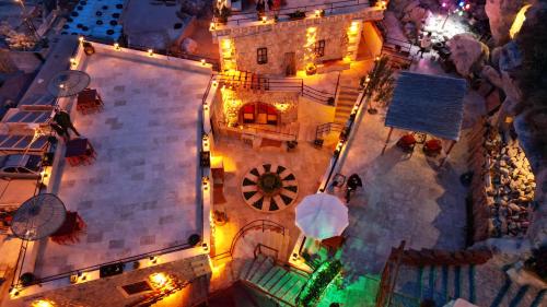 an overhead view of a building at night with lights at Cappadocia Nar Cave House & Swimming Pool in Nevsehir