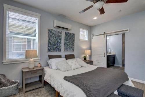 a bedroom with a bed and a ceiling fan at 5787 Coffey Villa Perfect for Traveling Professional in Garden City