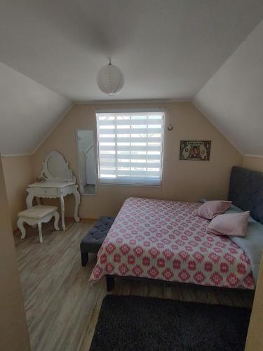 a bedroom with a bed and a window and a piano at Casa amplia turistas 7 personas in La Serena