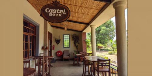 a restaurant with a sign that reads casal beer at Sunrise Motel in Lilongwe