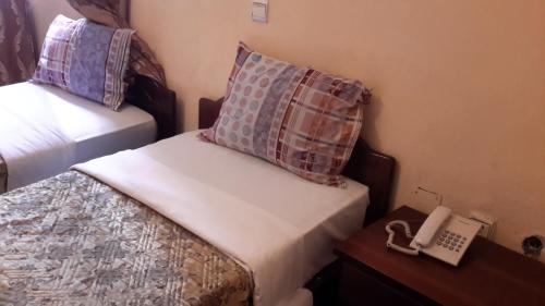 Postel nebo postele na pokoji v ubytování Piassa Hotel