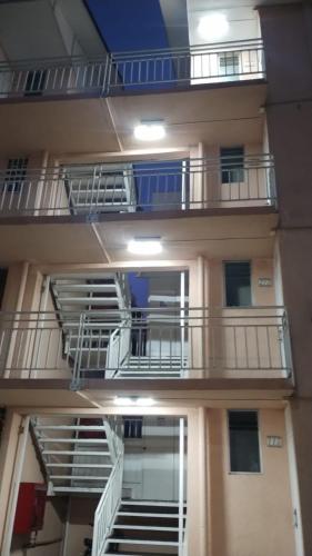 un edificio con balcones y escaleras en el lateral. en Dpto La Serena, en La Serena