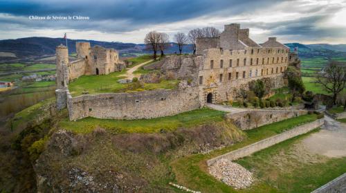 an aerial view of a castle on a hill at Le Valadin in Valady