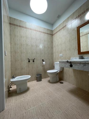 a bathroom with a toilet and a sink at Casa Mic&ele in Playa Blanca