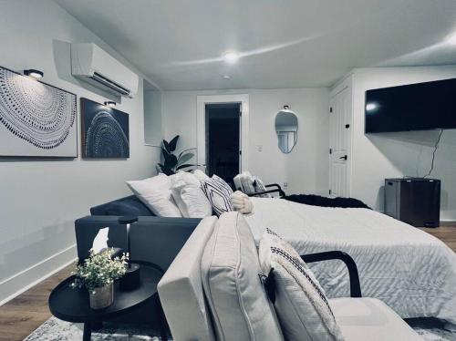 a bedroom with a large bed and a table at Urban Oasis, OTR Near Casino & Downtown! - 2 beds in Cincinnati