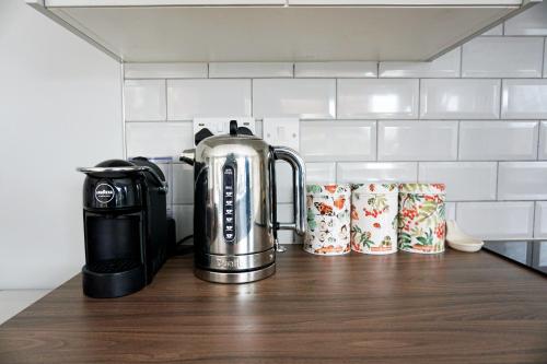 a coffee maker on a counter in a kitchen at Love Lane Villa in Lincoln