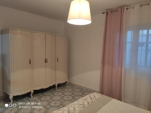 Un pat sau paturi într-o cameră la Bonito apartamento en castillo san Felipe Nijar