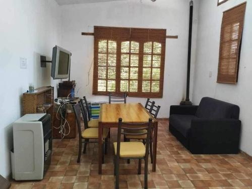 a living room with a table and a couch at cabañas las moras in La Granja