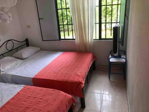 Krevet ili kreveti u jedinici u okviru objekta Fresca casa completa Monterrey casanare