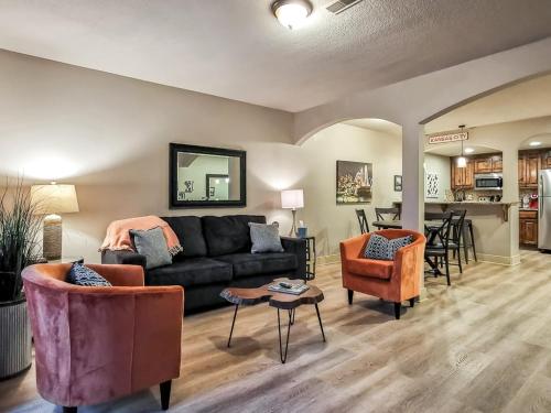 a living room with a couch and chairs and a table at Large Plaza 2BR BTH in Kansas City