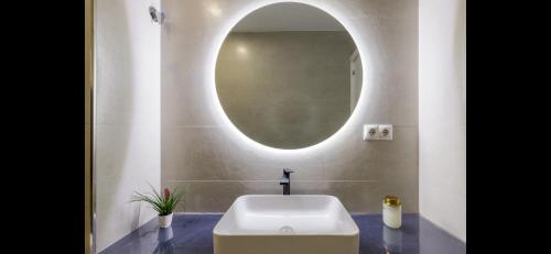 a bathroom with a white sink and a mirror at Picasso 2 Luxury in Málaga